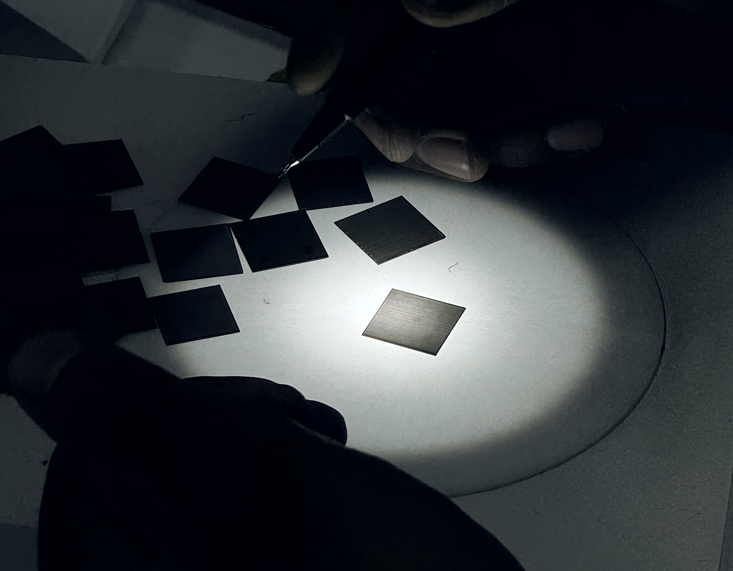Seed wafers being selected on a lightbox before growth