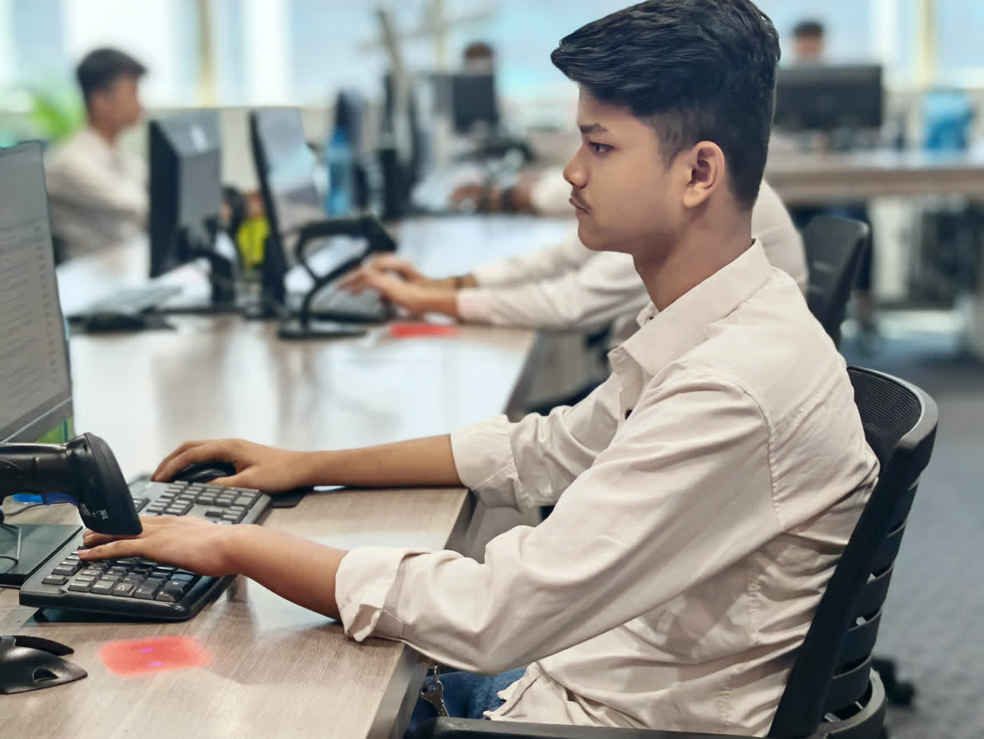 KIRA sales team member at his screen