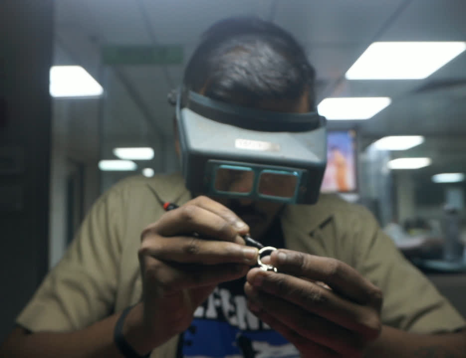 Setter working on a piece of diamond jewellery
