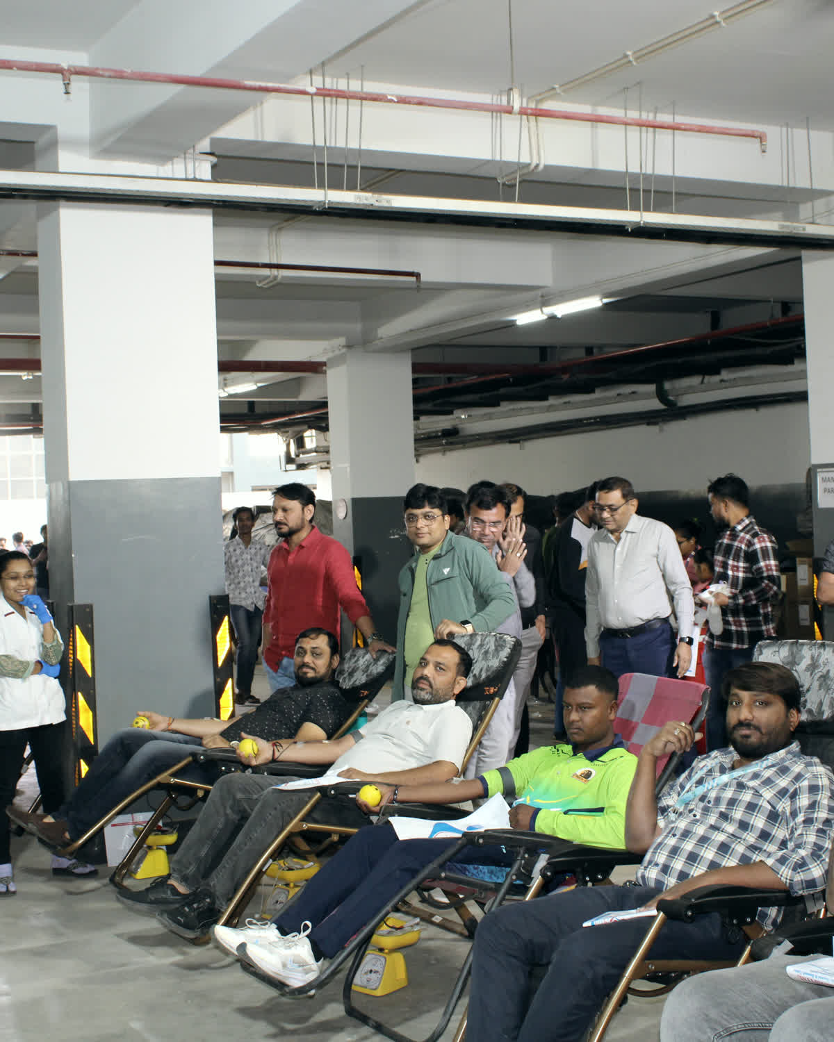 Employees at a blood donation camp